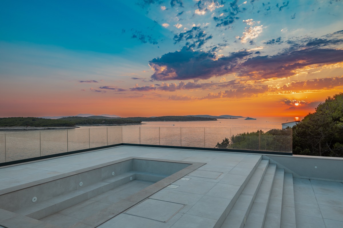 Roof terrace at sunset, view to the Pakleni Islands